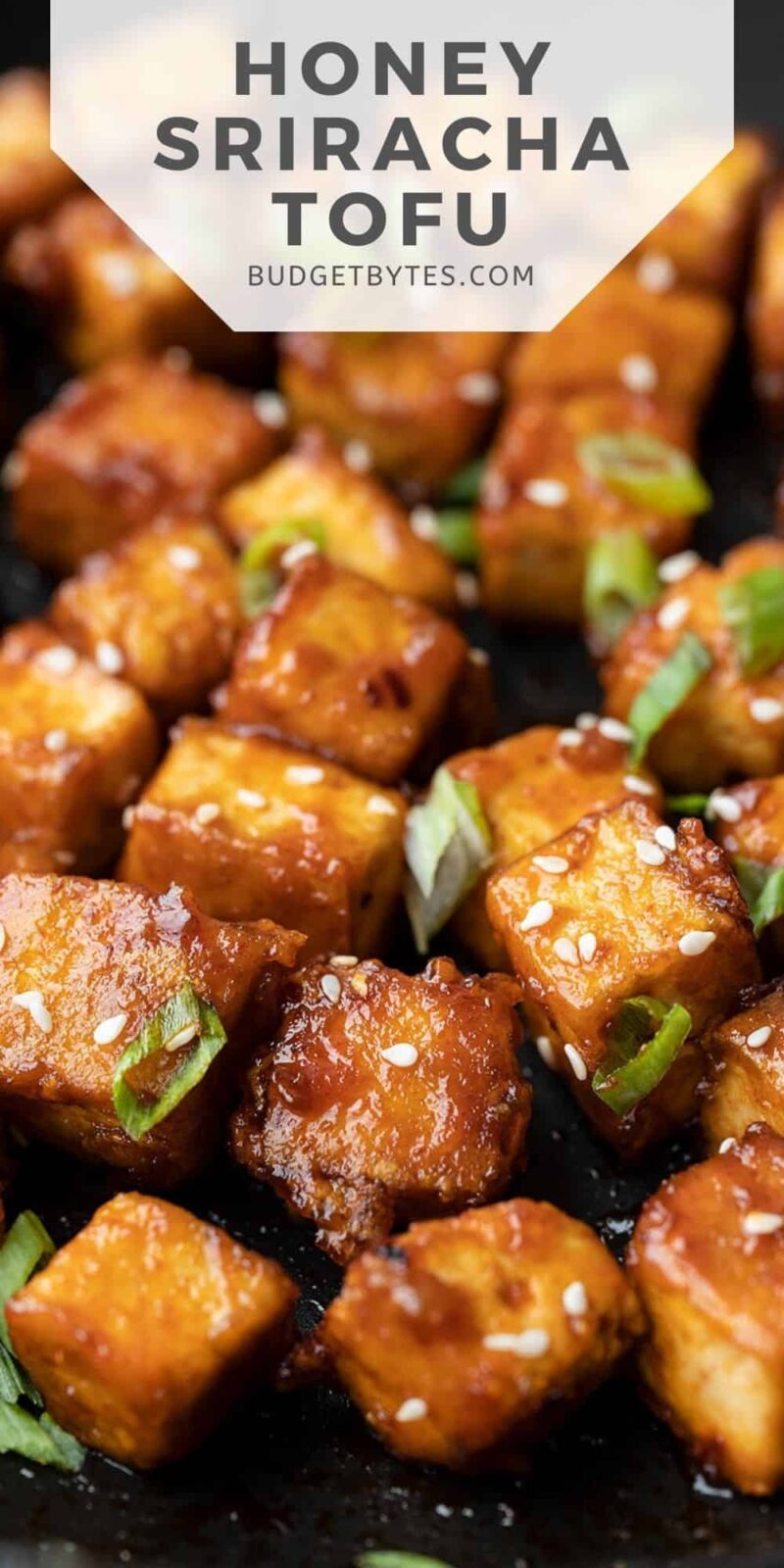 close up of honey sriracha tofu with title text at the top