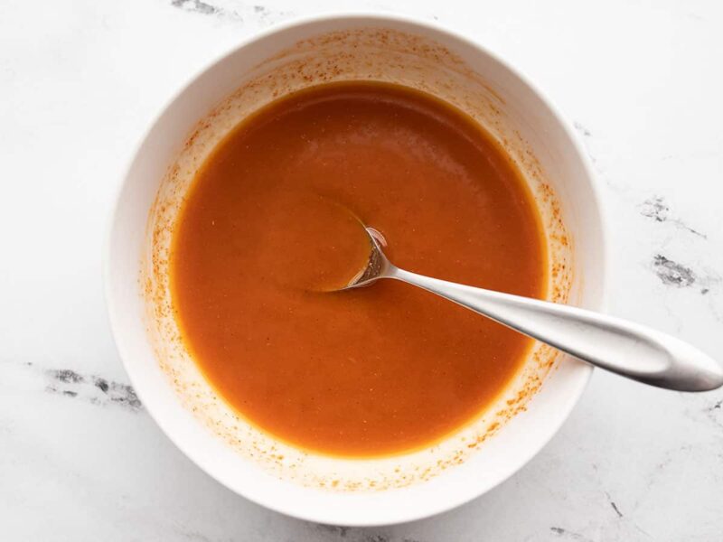 seasoned butter in a bowl with a spoon