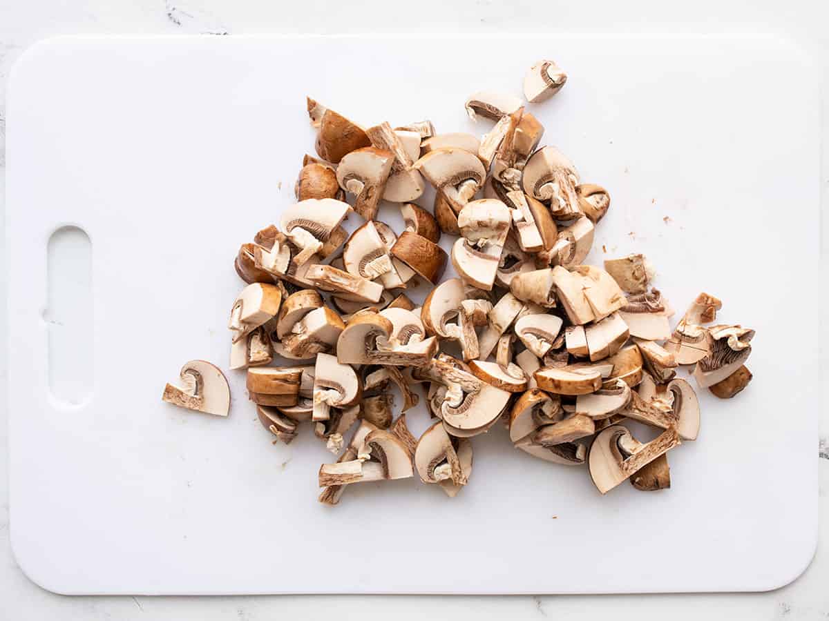 Sliced mushrooms on a cutting board