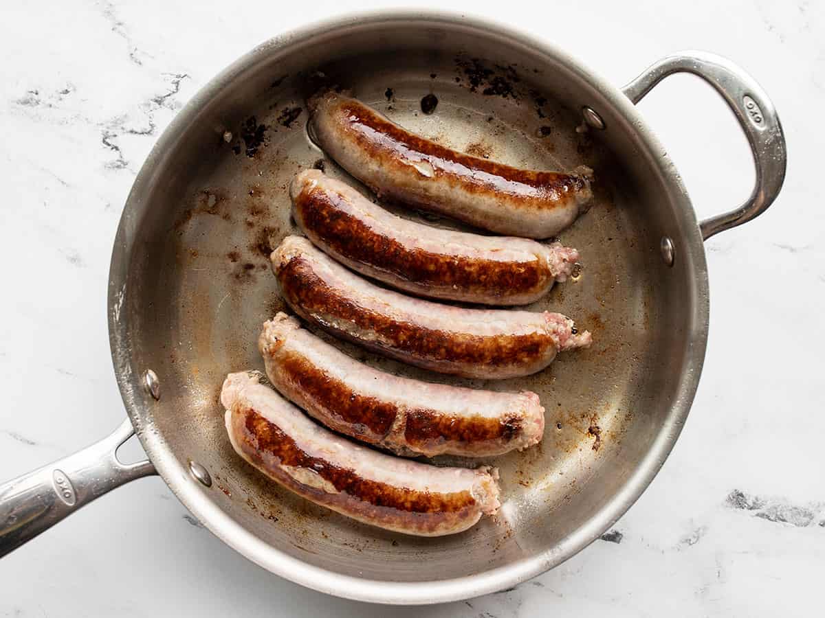 Browned bratwurst in a skillet