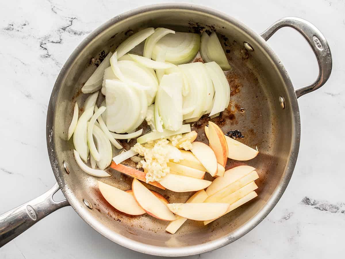 onions and apples added to the skillet