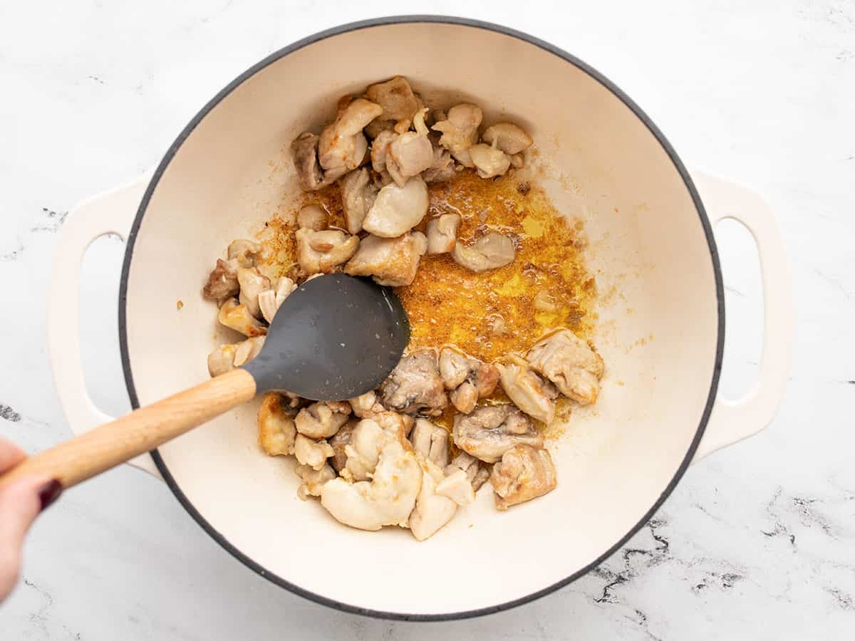 Browned chicken thighs in the pot