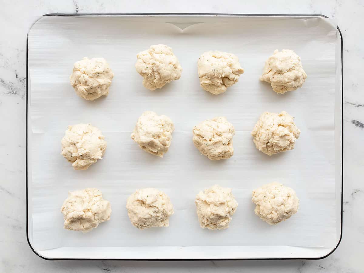 portioned biscuits on the baking sheet