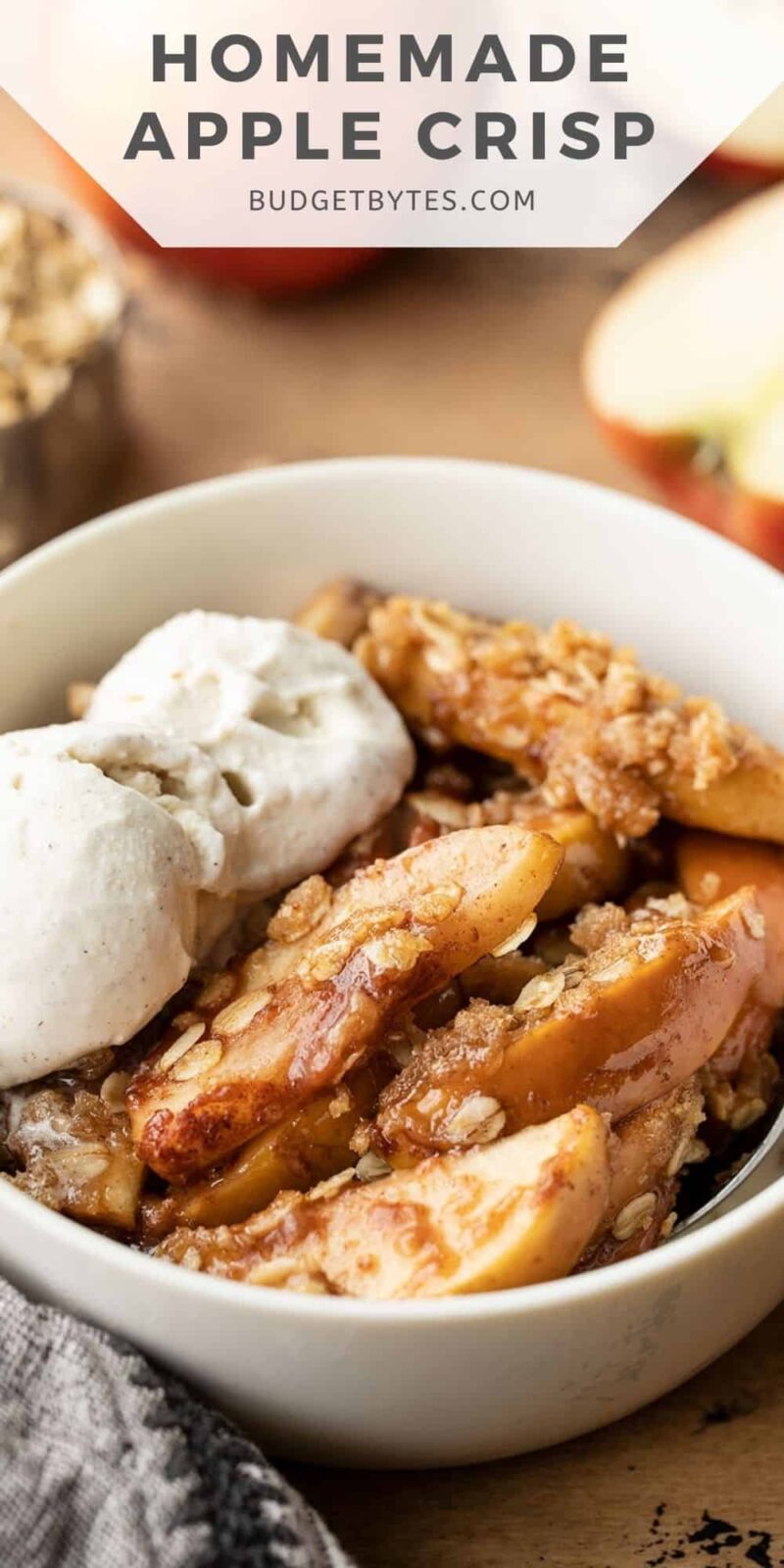 side view of apple crisp in a bowl, title text at the top