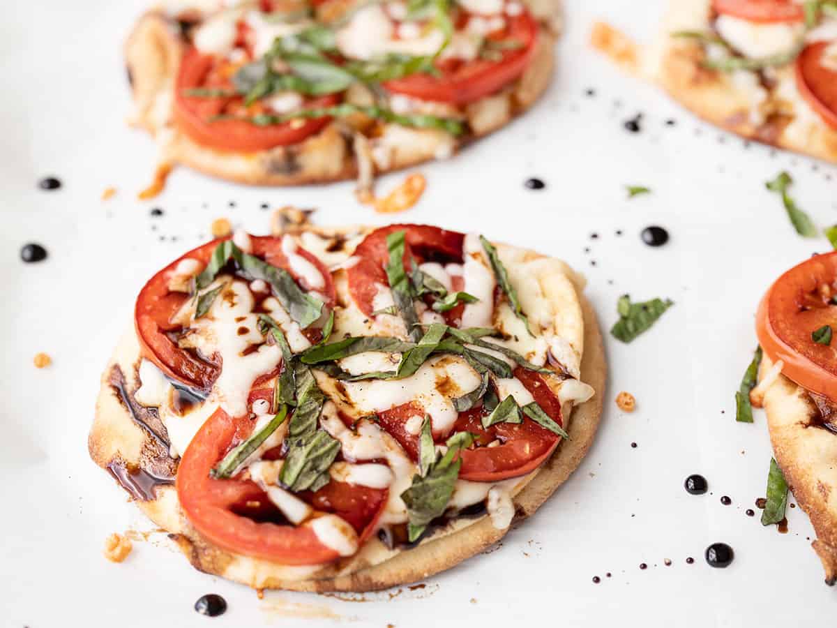 Close up side view of a caprese pizza