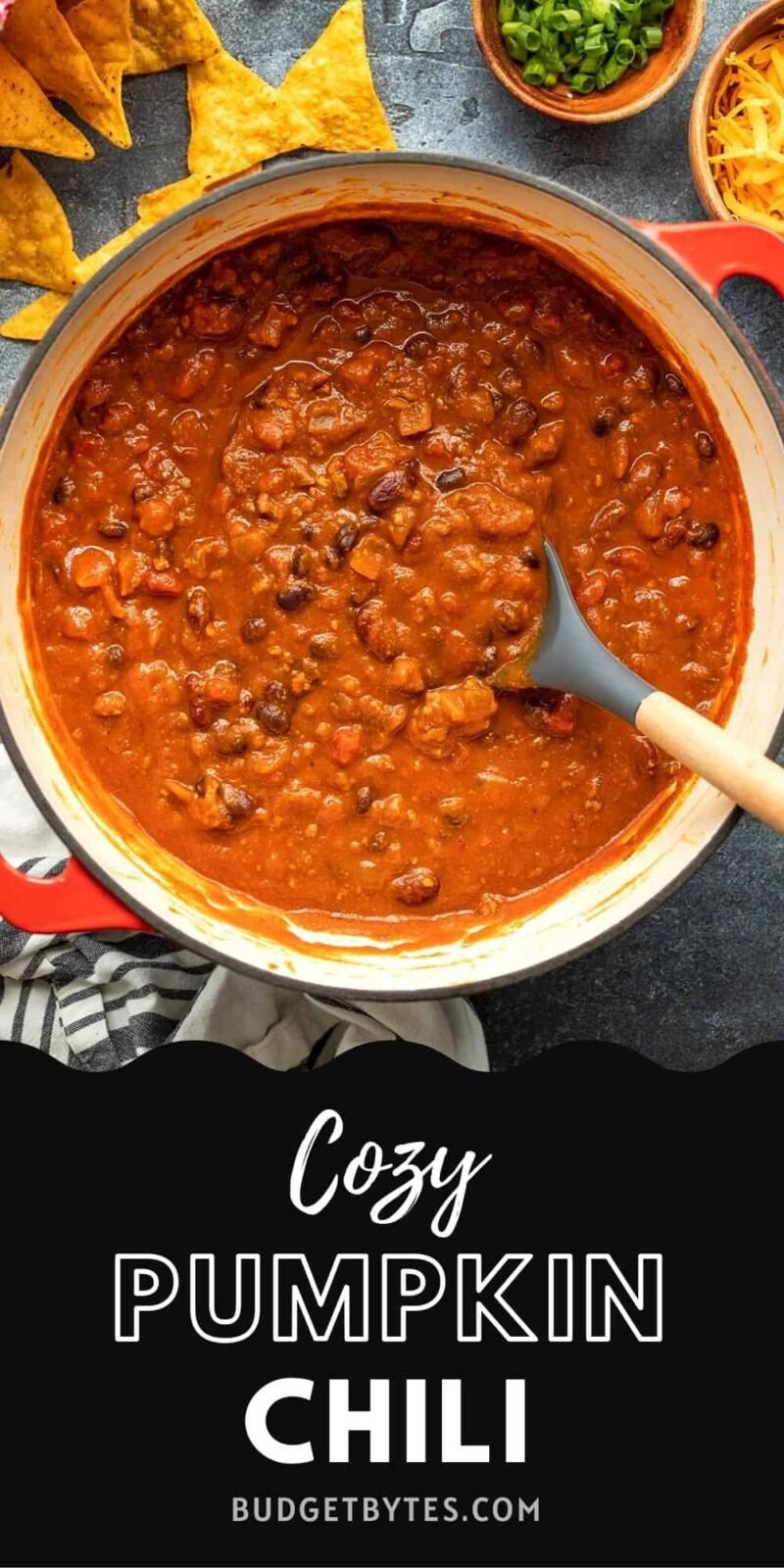 Overhead view of a pot of pumpkin chili, title text at the bottom