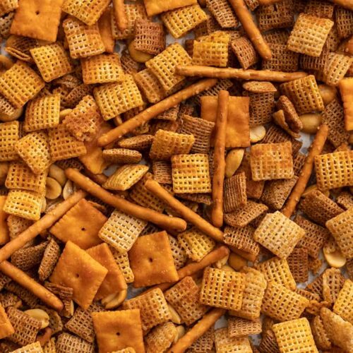 Close up of spicy chex mix on the baking sheet