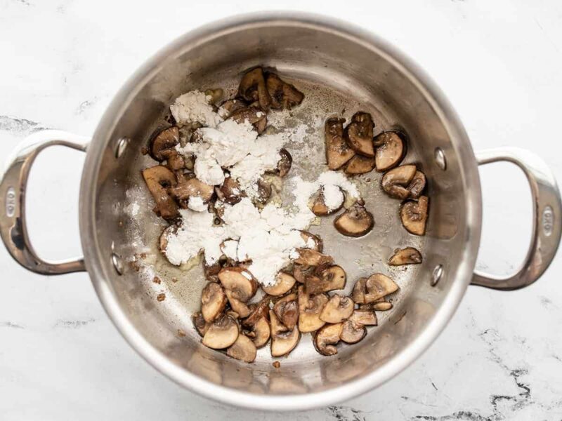 flour added to mushrooms in the pot