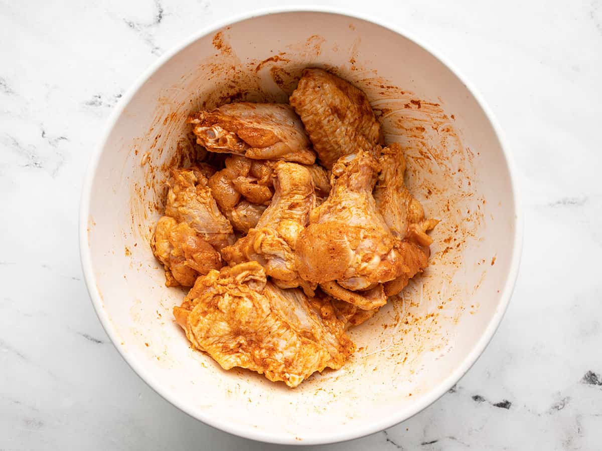 Seasoned chicken wings in a bowl