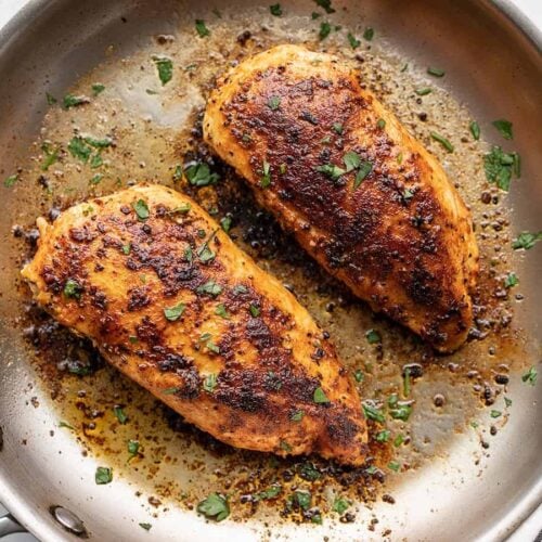 close up of cooked chicken breasts in the skillet