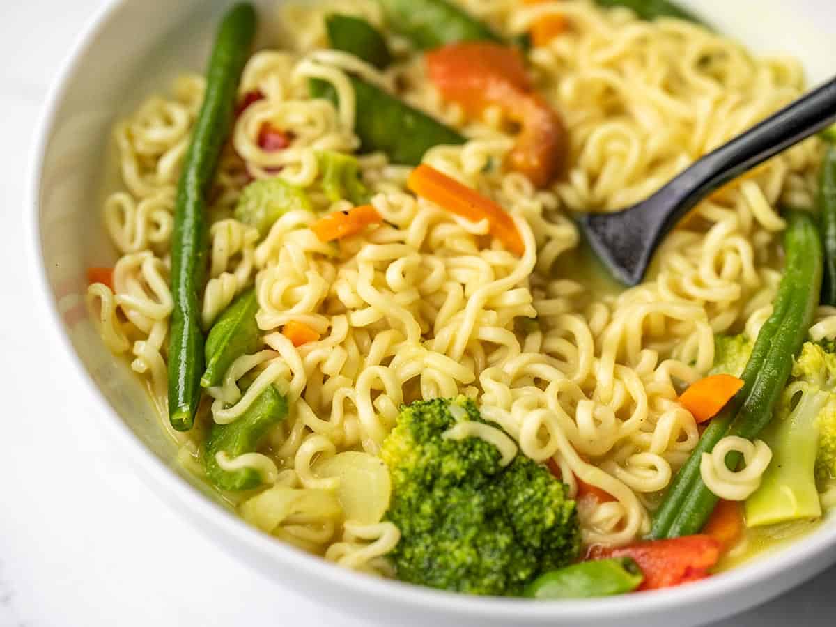 close up side view of a bowl of coconut curry ramen