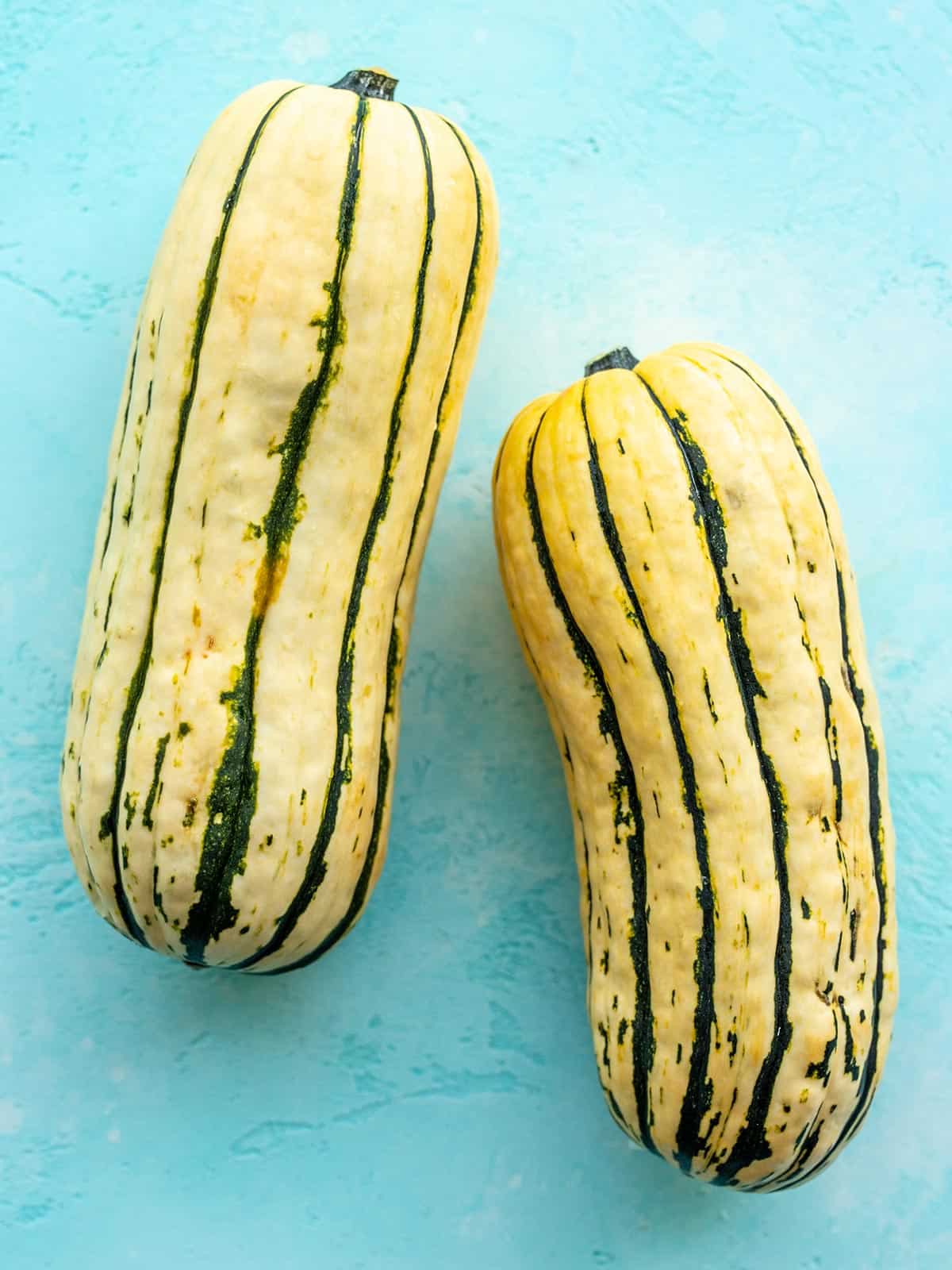 Two whole delicata squashes