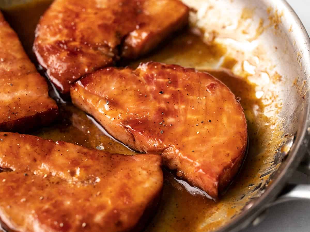 Glazed Ham Steaks in the skillet close up