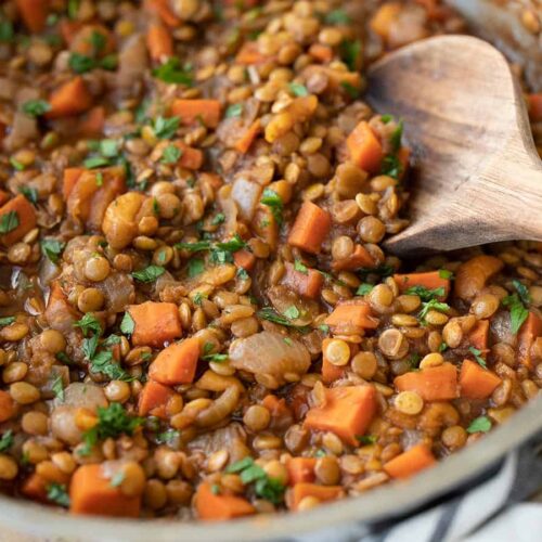 close up side view of spiced lentils in the skillet