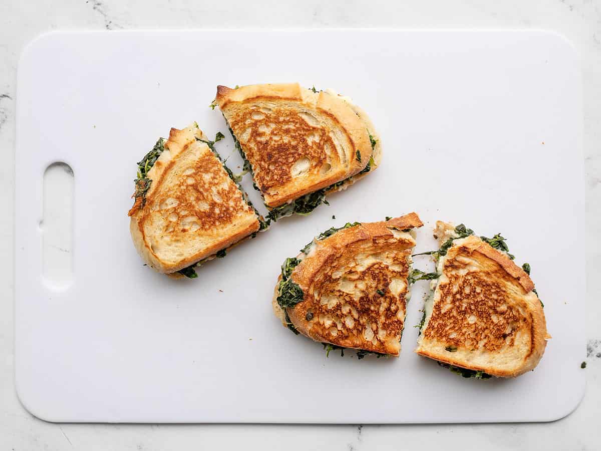 sliced sandwiches on a cutting board