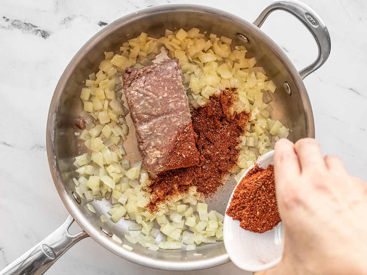 ground beef and taco seasoning added to the skillet