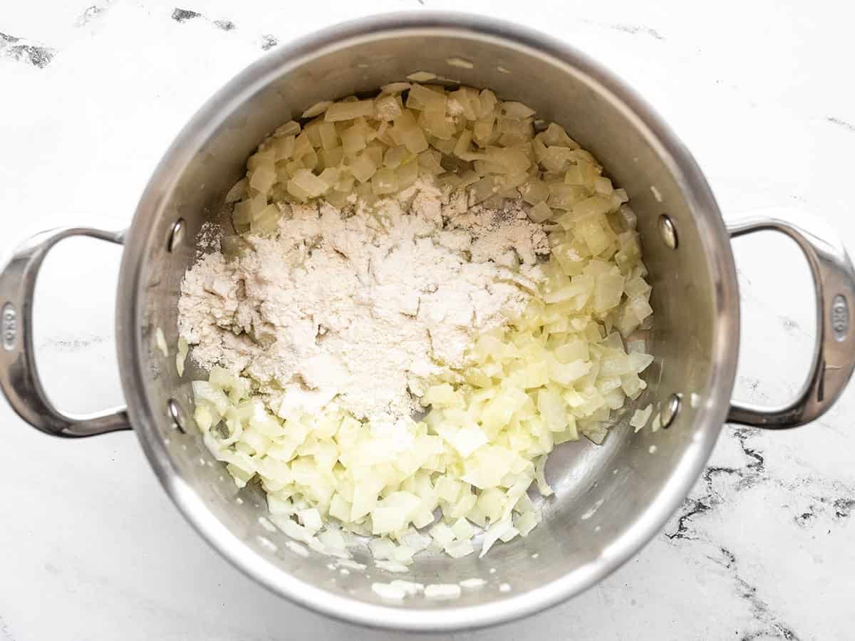 flour added to the onion, garlic, and butter in the soup pot.