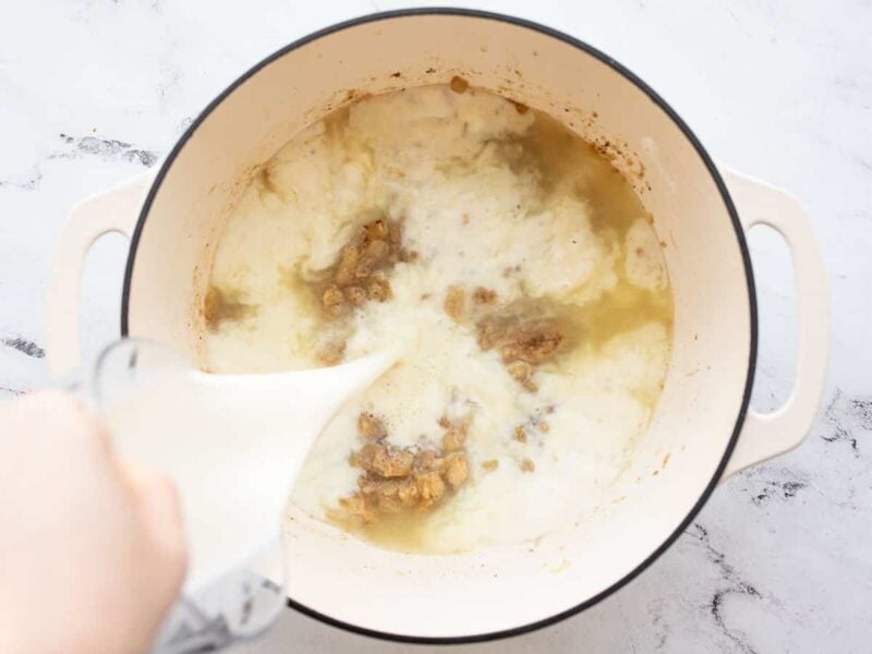 broth in the soup pot, milk being poured in. 