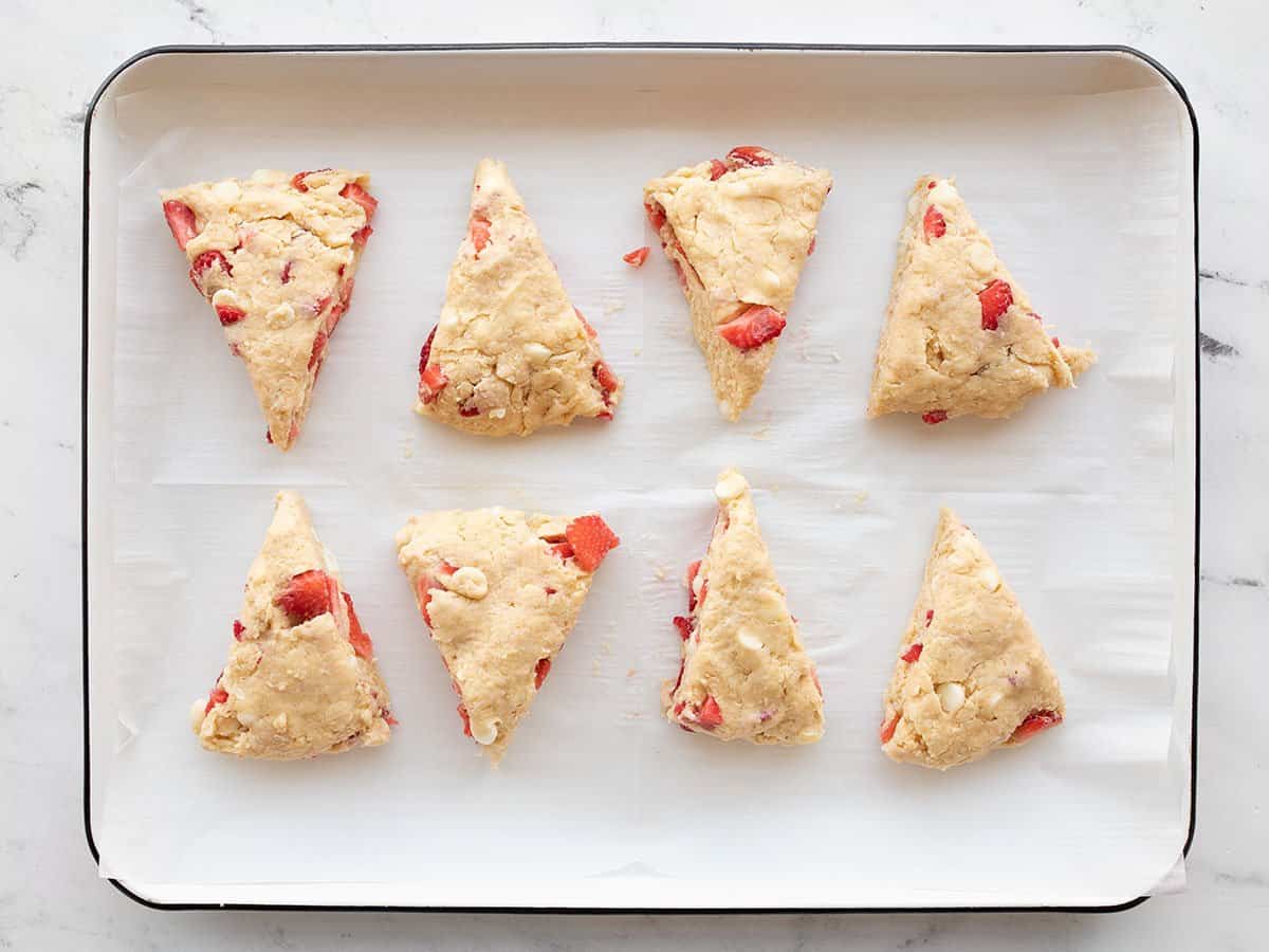 Cut scones on a lined baking sheet