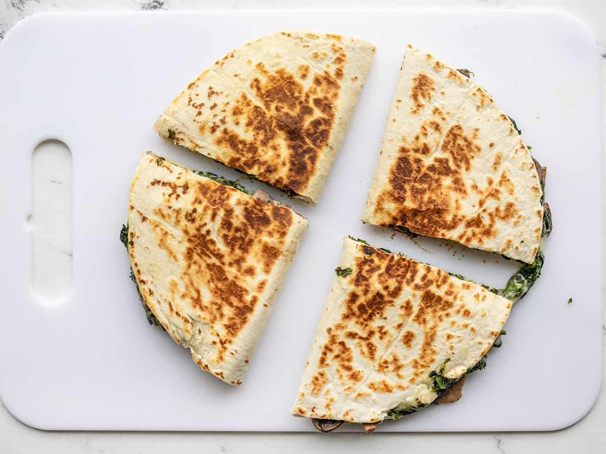 spinach and mushroom quesadillas cut in half