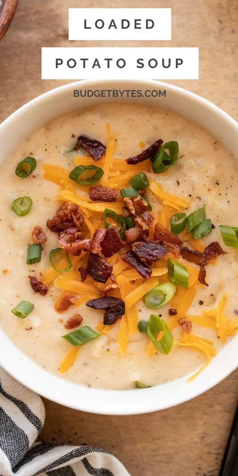 close up overhead view of a bowl of loaded potato soup, title text at the top.