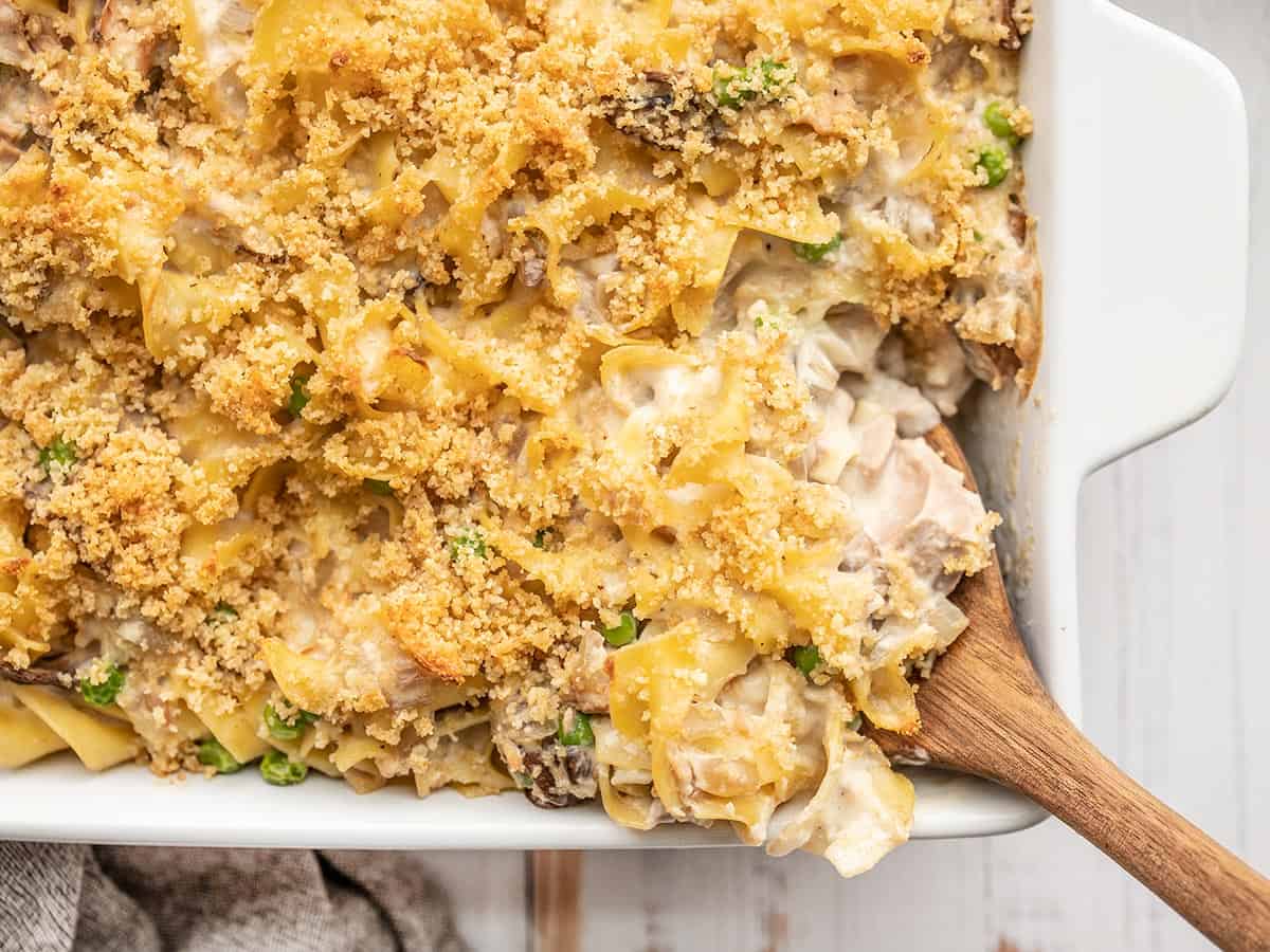 close up of tuna noodle casserole being scooped out of the dish