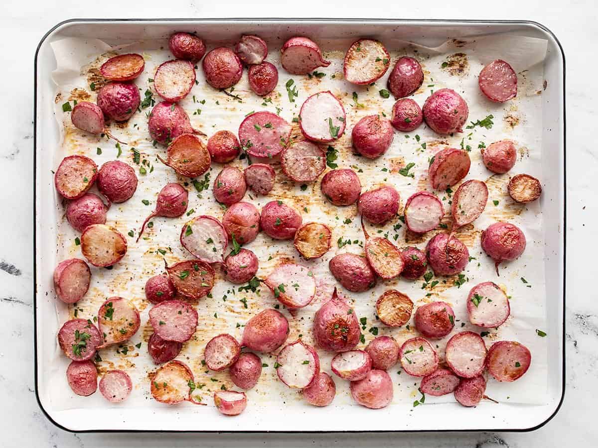 Roasted radishes garnished with chopped parsley.