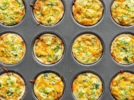 mini broccoli cheddar quiches in a muffin tin.