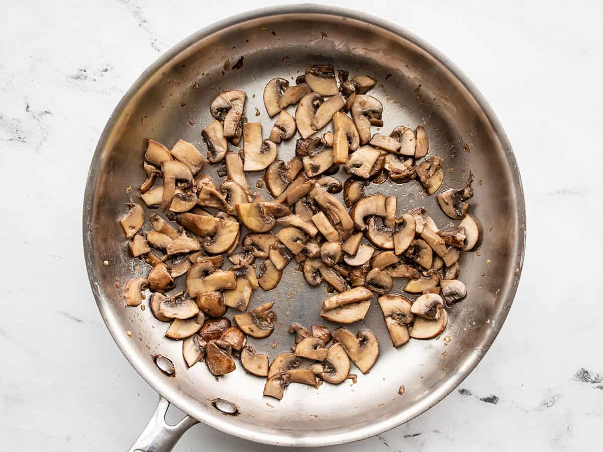 Sautéed mushrooms in the skillet.