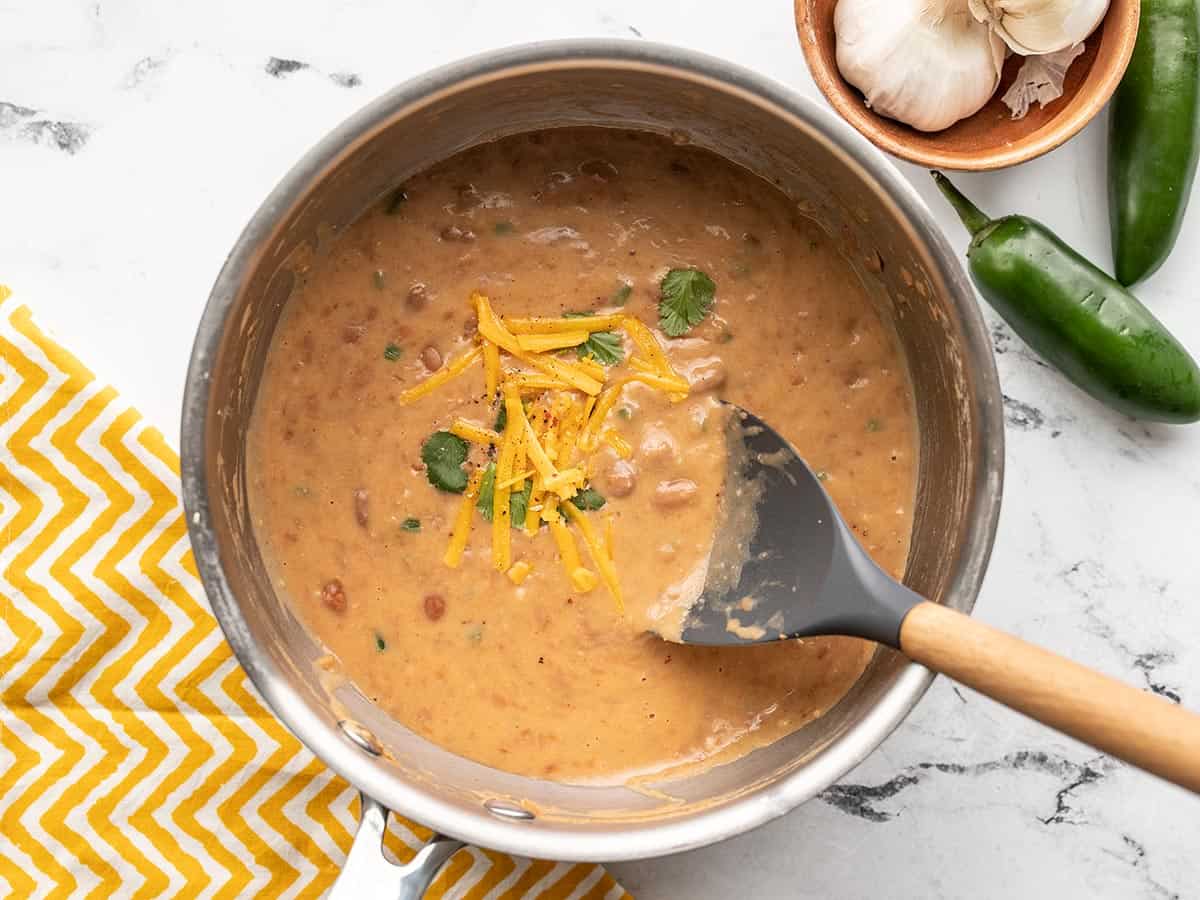 Finished cheesy pinto beans in the pot.