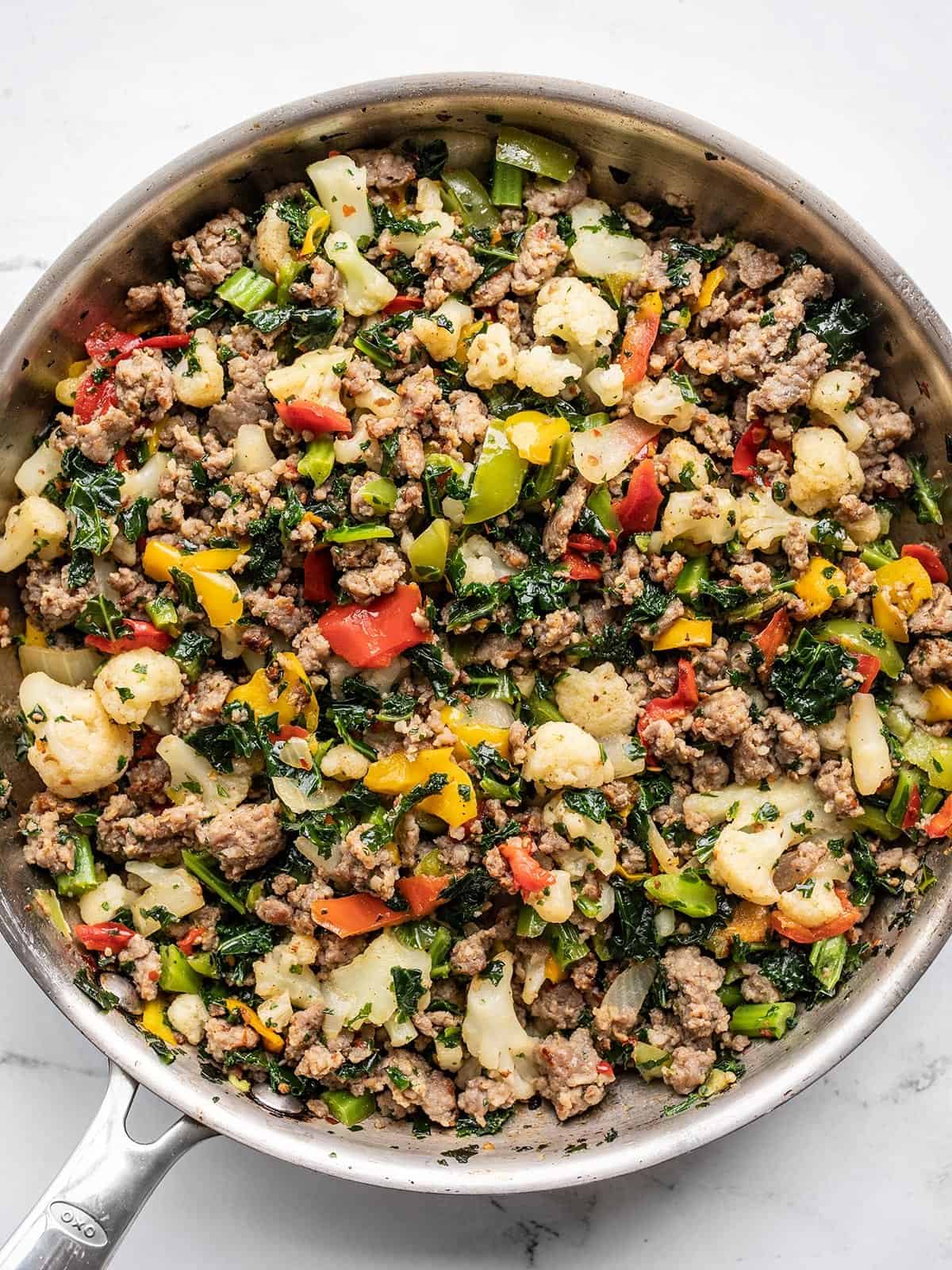 skillet full of sausage and vegetables from above