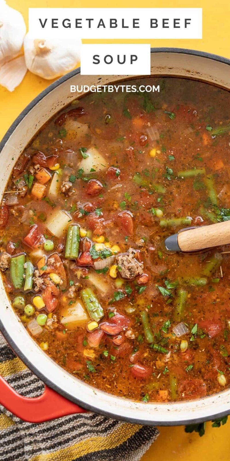 Overhead view of a pot of vegetable beef soup.