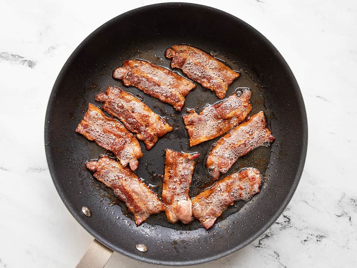 Cooked bacon in a skillet.