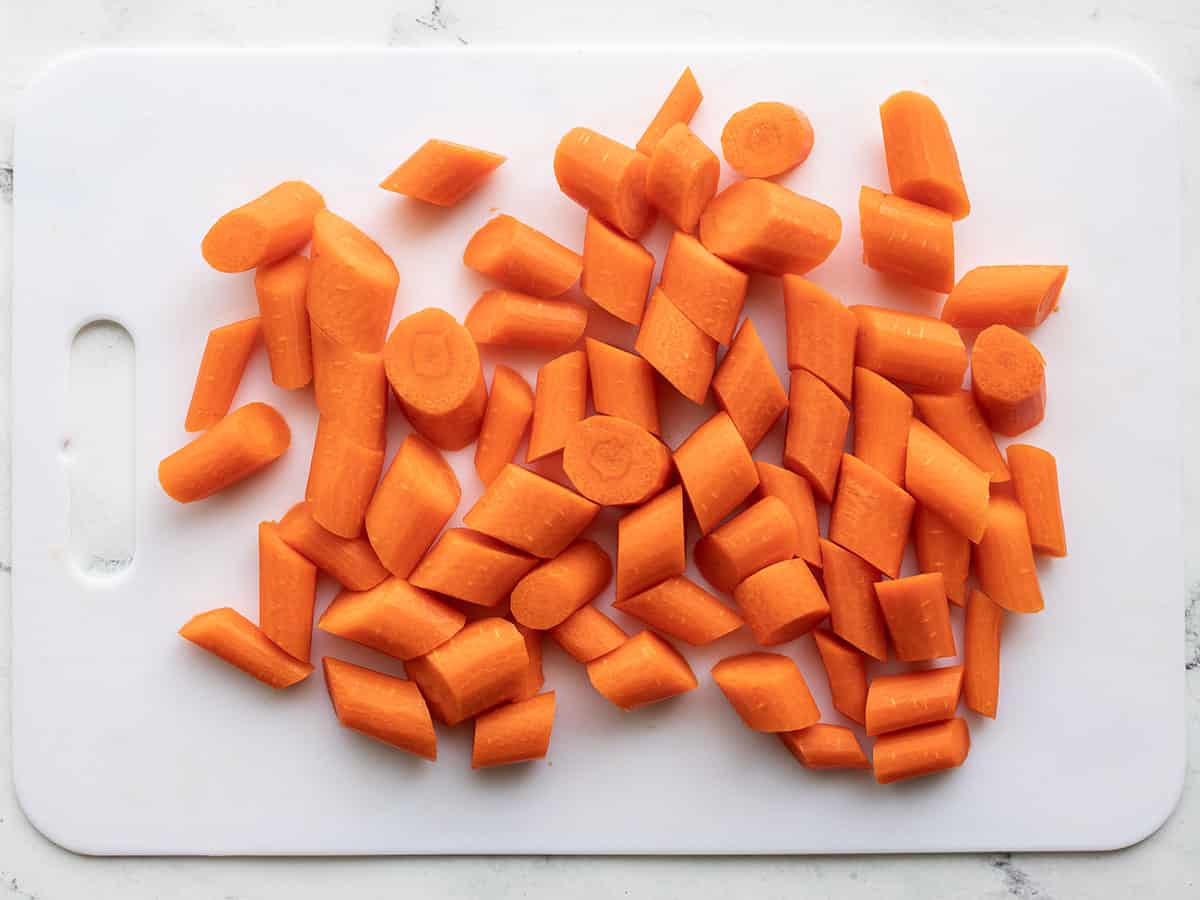 Sliced carrots on a cutting board.