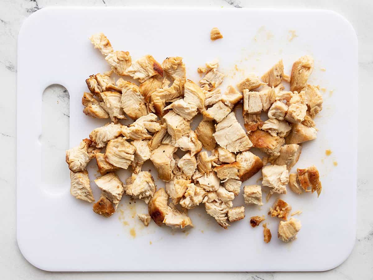 Chopped chicken on a cutting board.