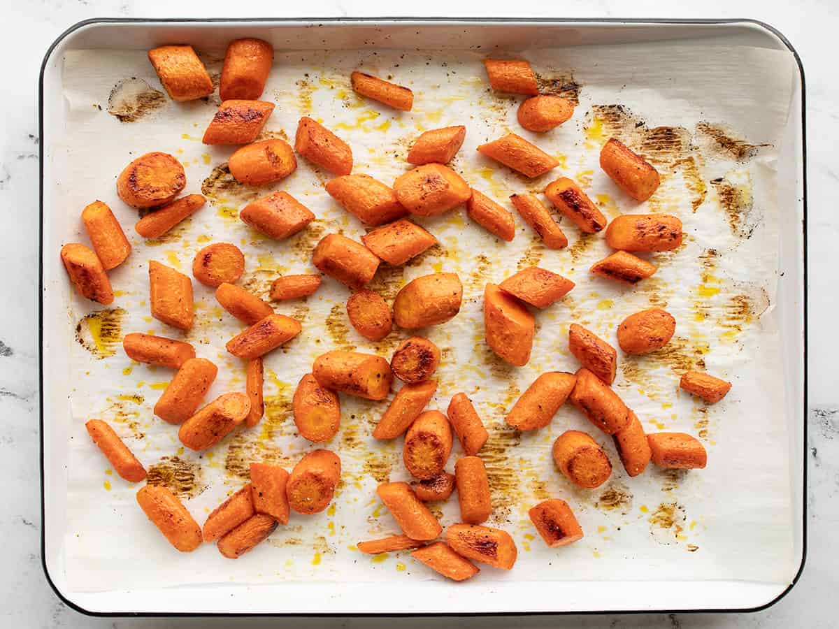 Roasted carrots on a baking sheet.