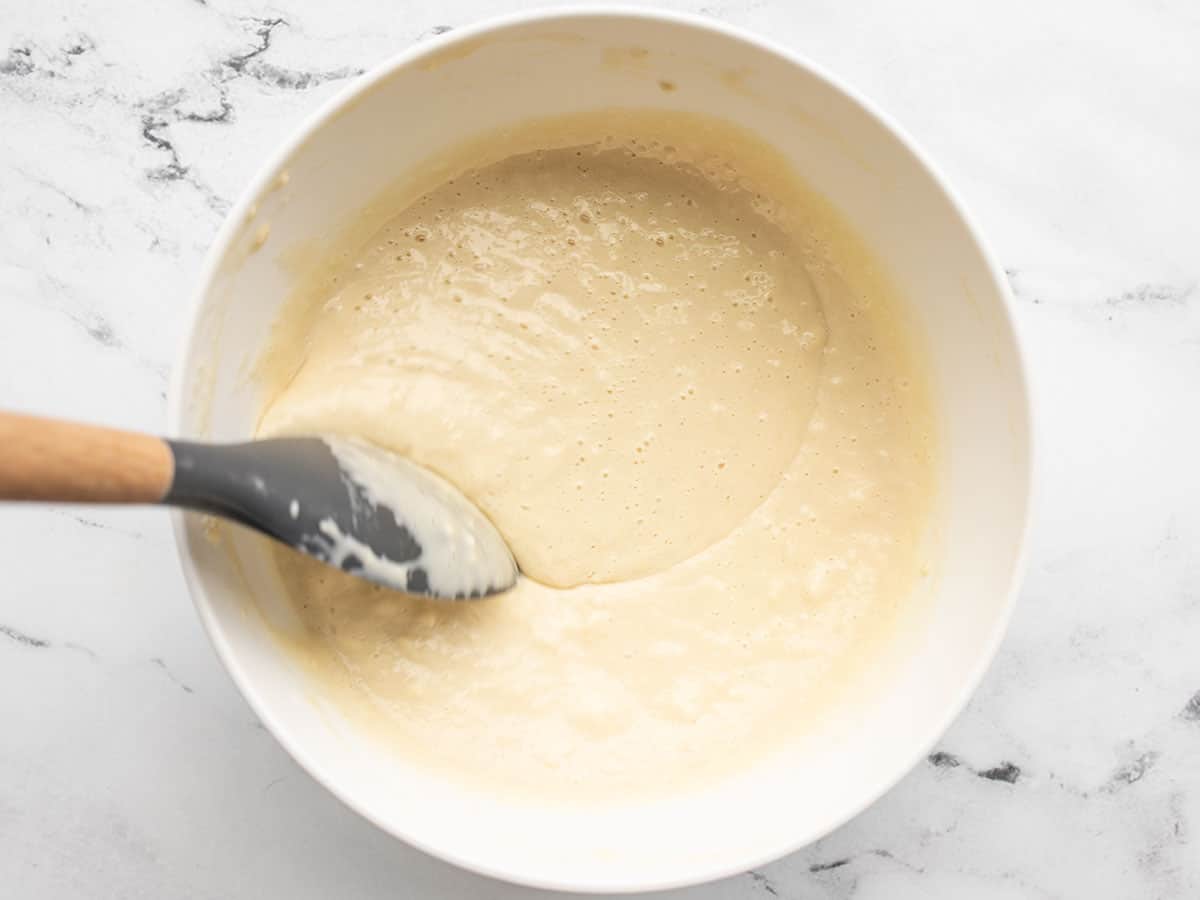 Pancake batter being stirred.