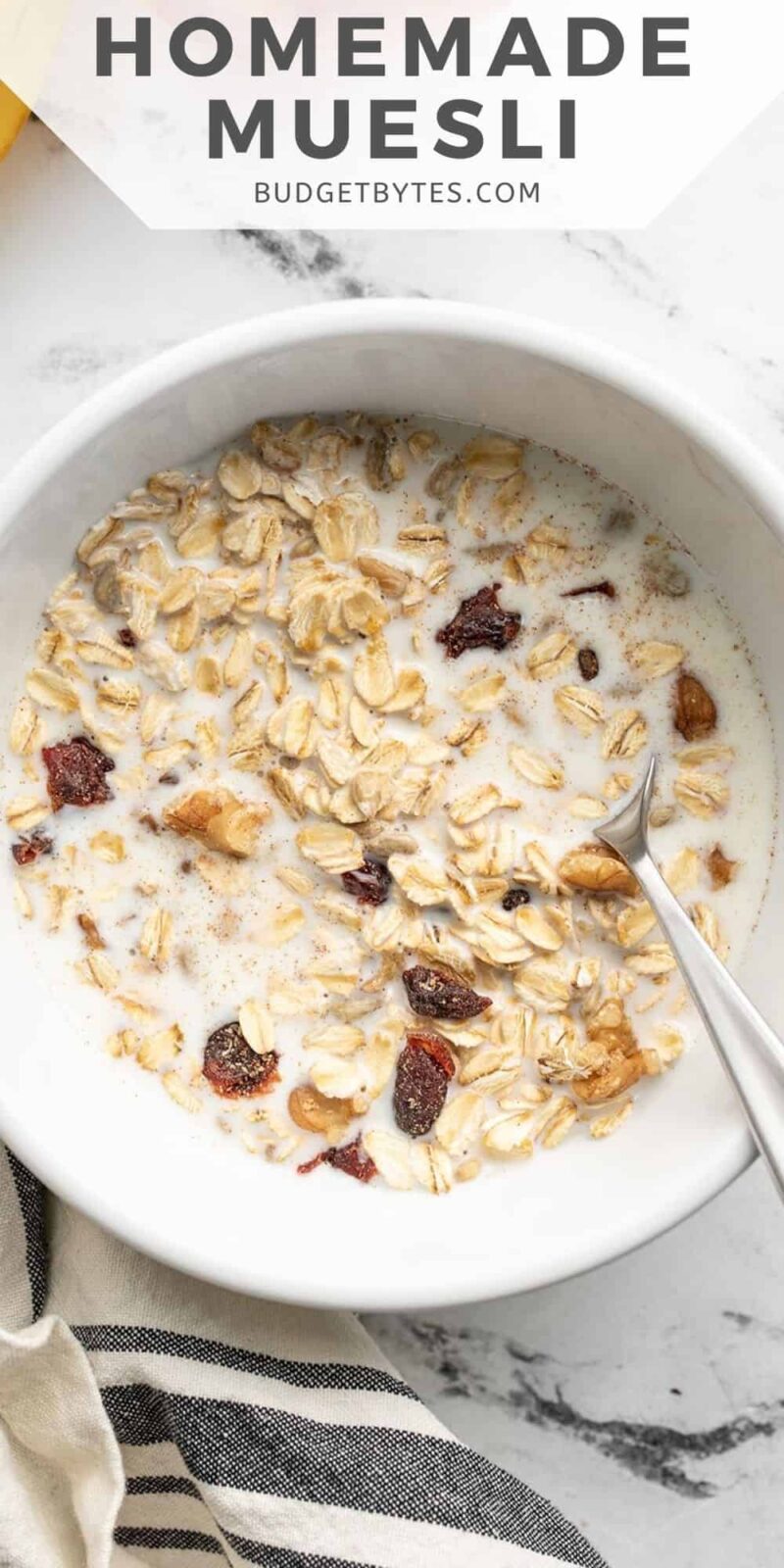 Overhead view of a bowl of muesli with milk.