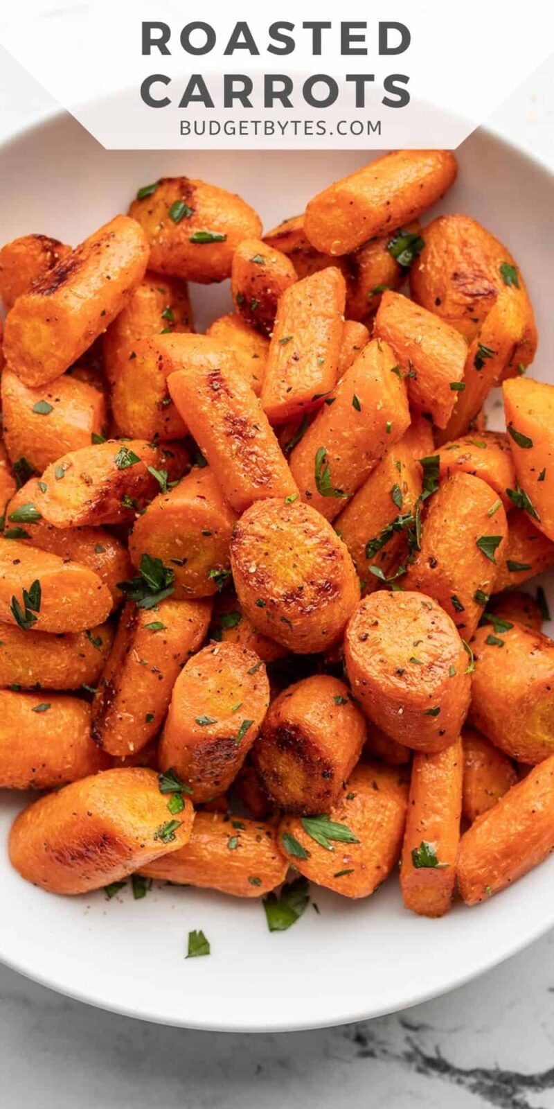 close up overhead view of a bowl of roasted carrots.