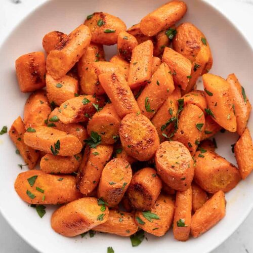 Roasted carrots in a bowl from above.