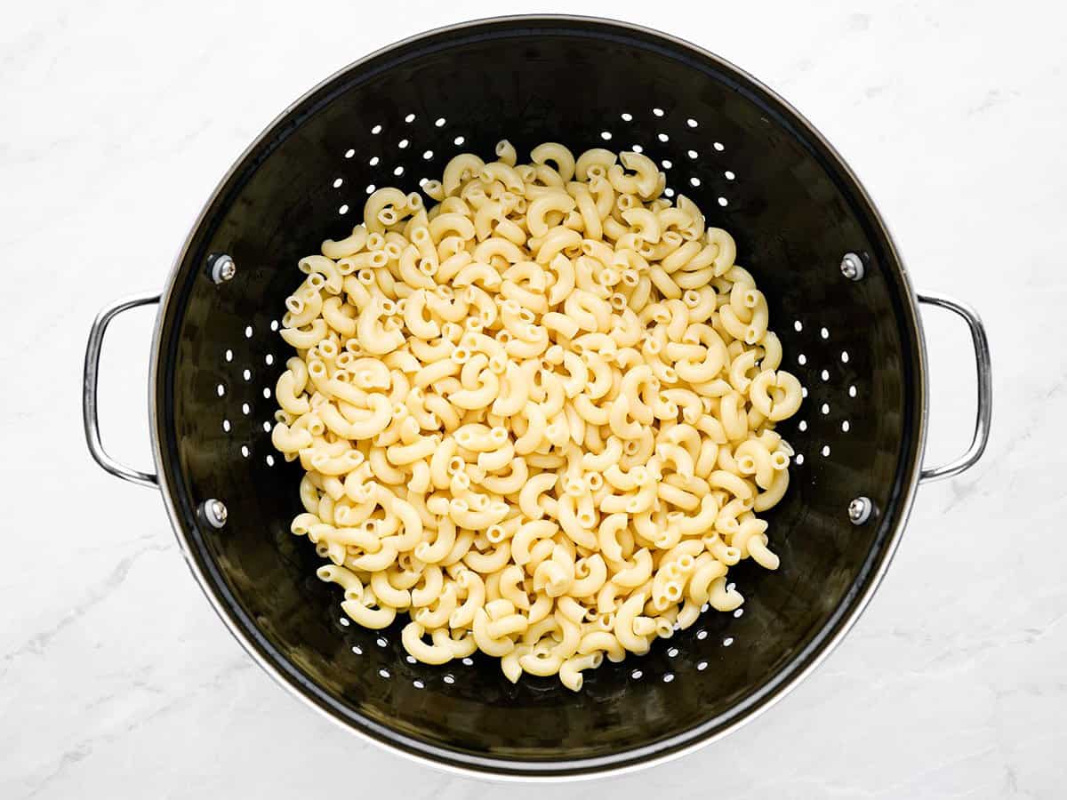 Cooked macaroni in a colander.