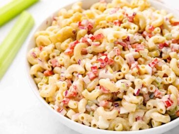 close up side view of macaroni salad in a bowl.