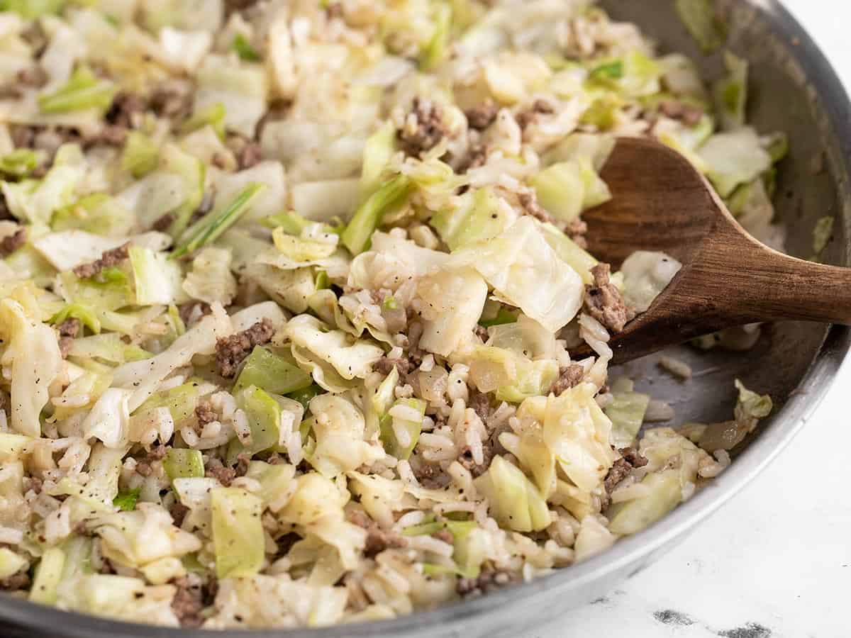 Side view of sautéed Beef, Cabbage, and Rice in the skillet.