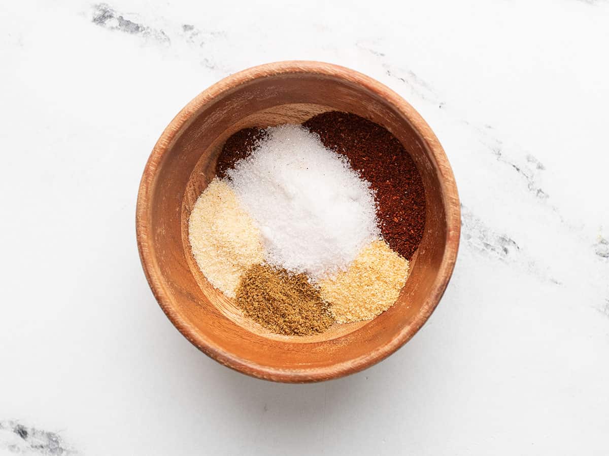 Fajita spices in a wooden bowl.