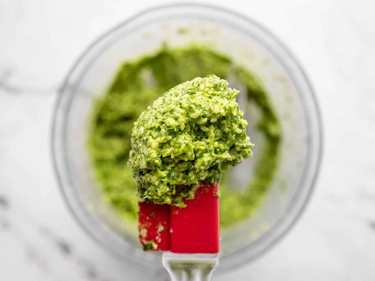 close up of parsley pesto on a spatula.