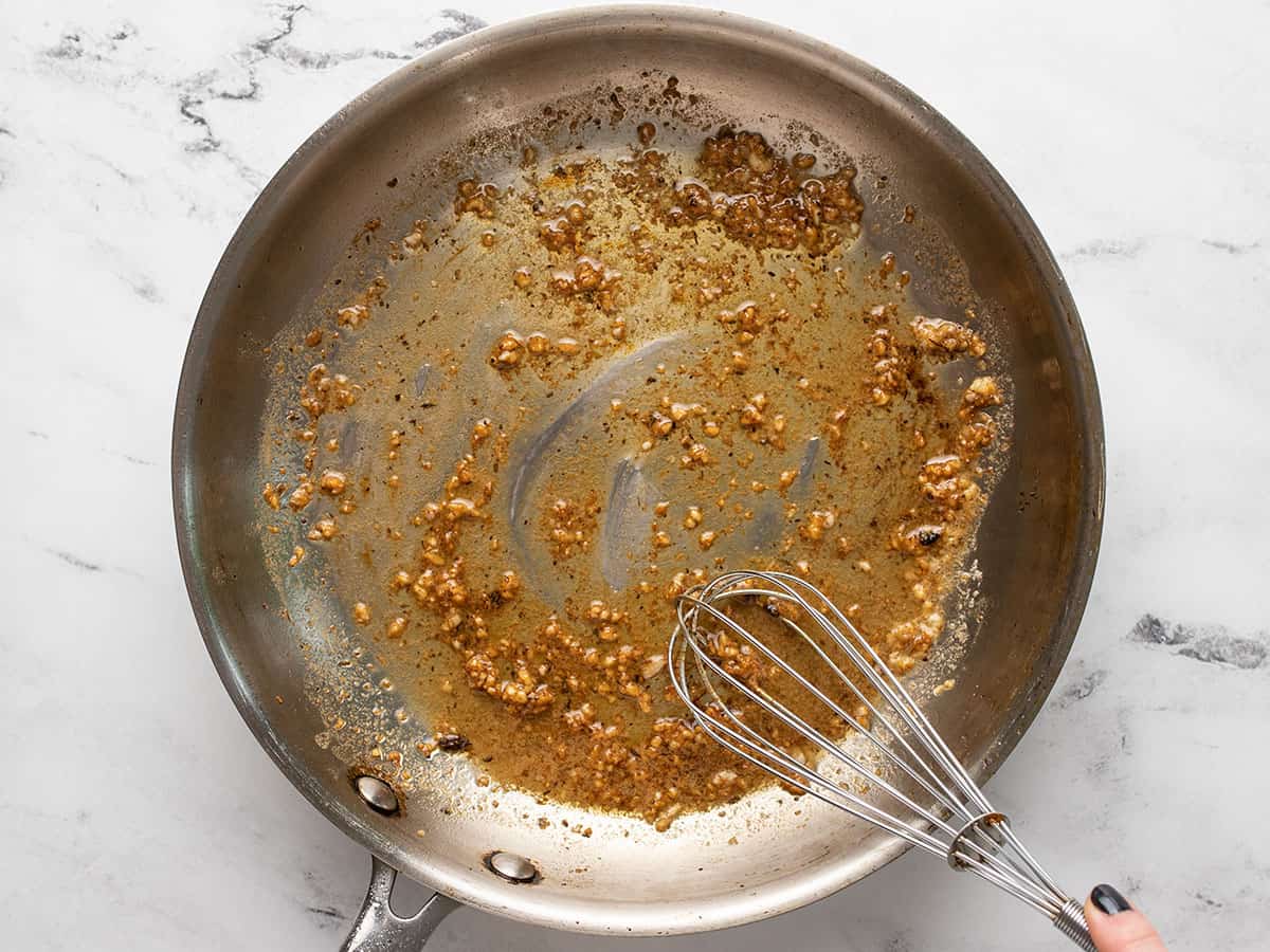 Deglazed pan with butter and garlic.