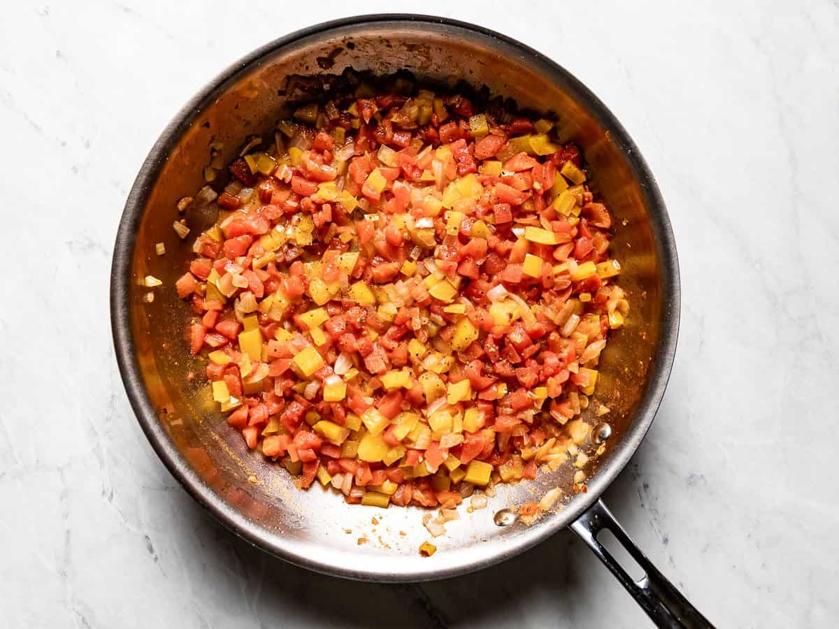 Sautéed vegetables in the skillet.