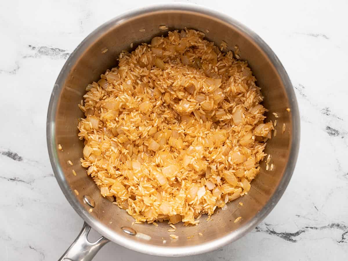 Rice and spices cooked in the pot.