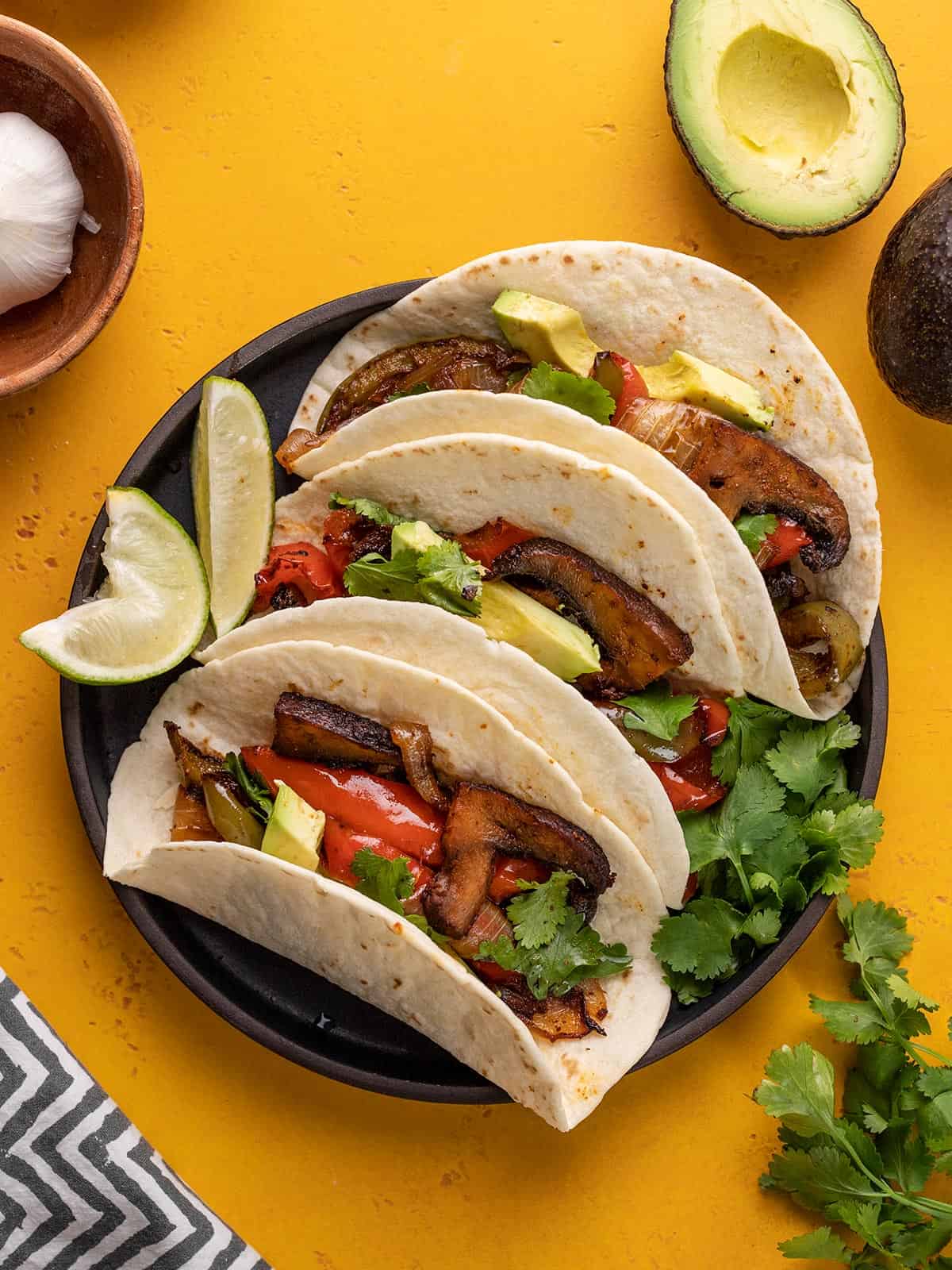 Three Portobello Fajitas on a plate.