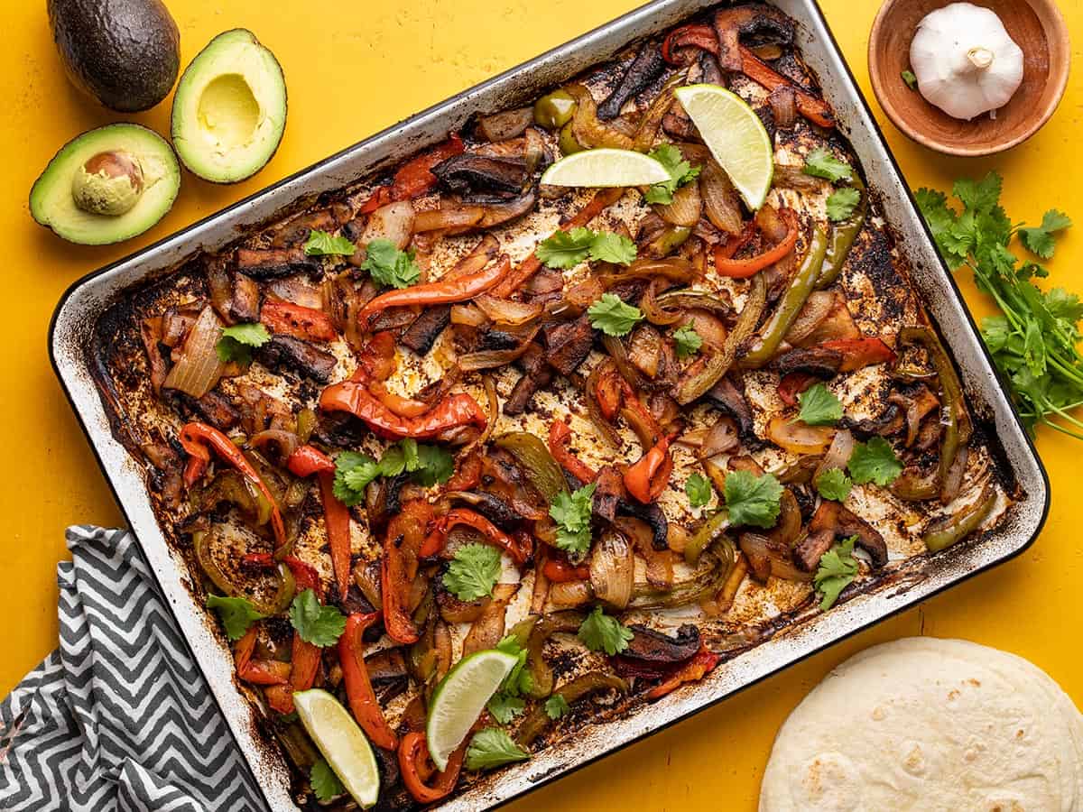 Overhead view of the fajita vegetables on a sheet pan.